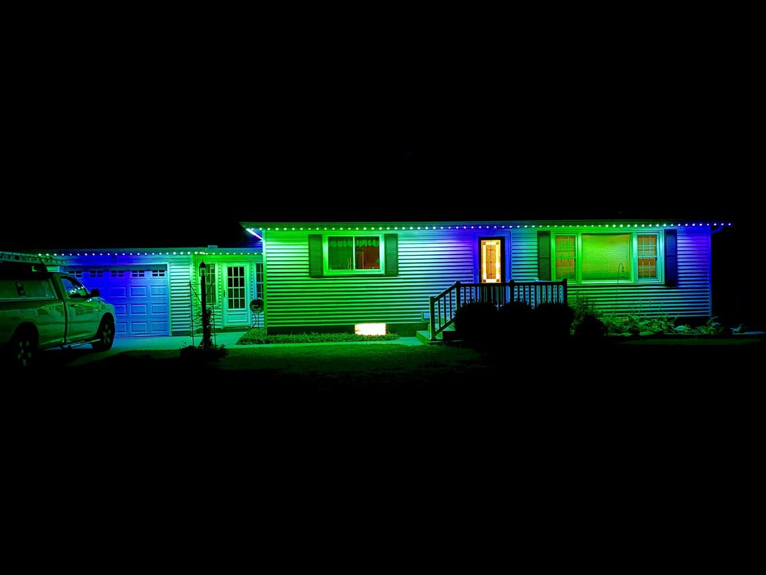 Permanent lighting color-changing from blue to green along a roofline